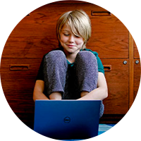 Student using tablet device with apps