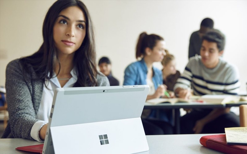 Microsoft businessman working on Surface Studio device